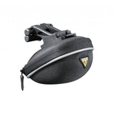 Topeak Propack lightweight bike seat pack with quick release and reflective piping mounted on bike saddle.