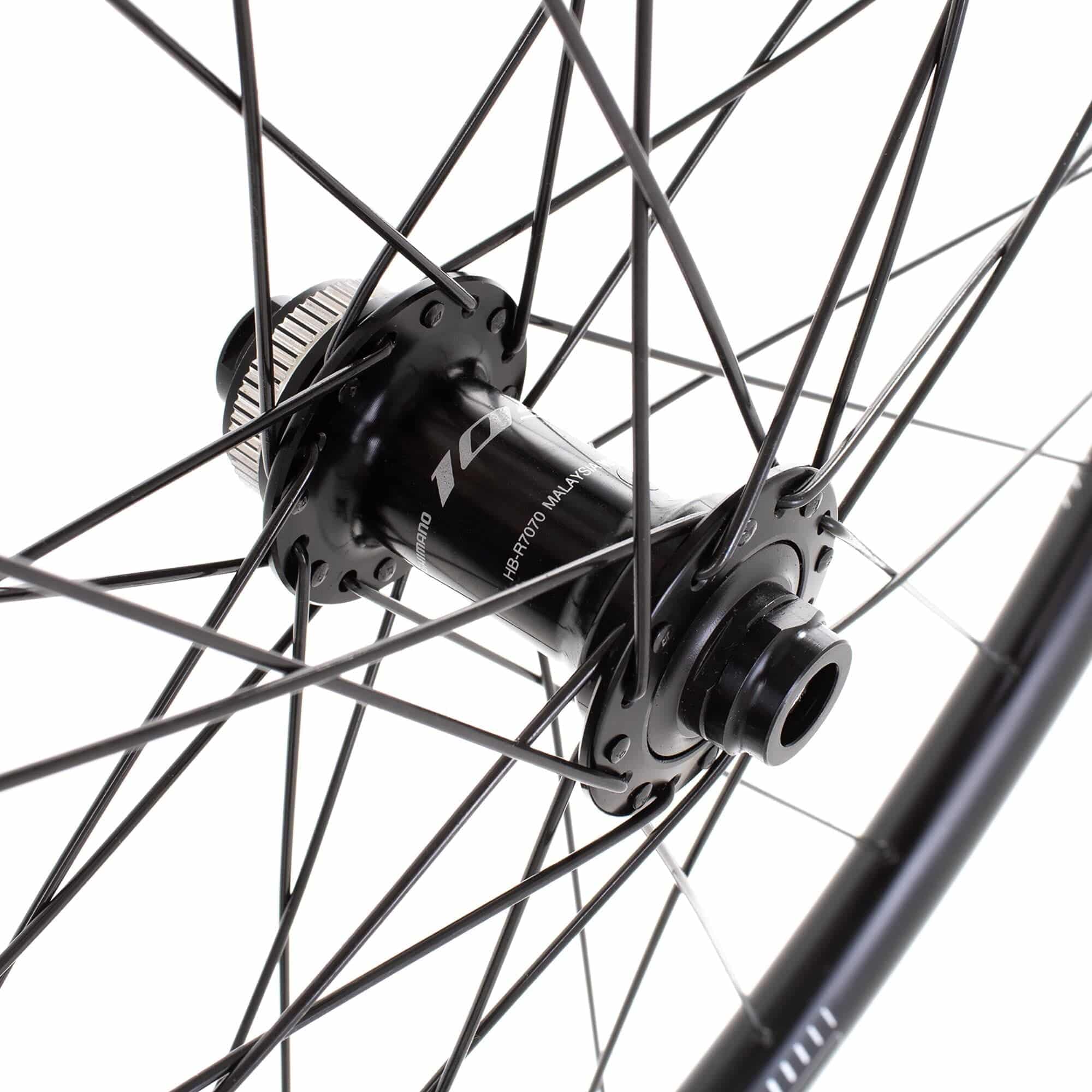 M Part Wheels gravel front wheel with 700c rim, Shimano 105 CL hub, 100x12mm TA, TLR G 540 rim for cycling components.