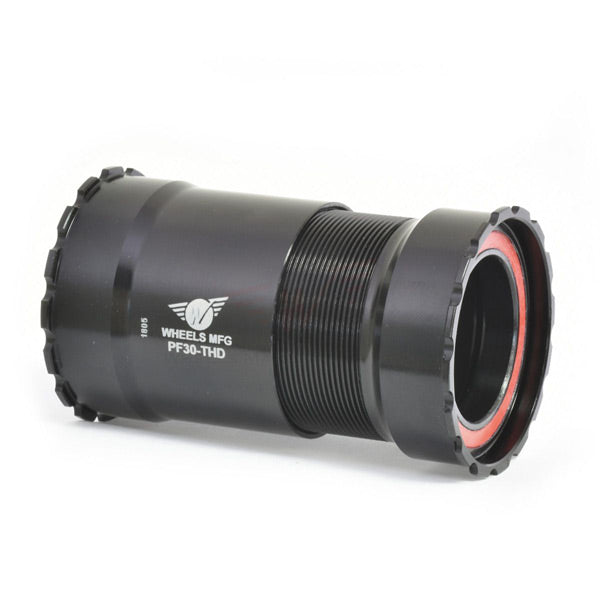 Wheels Manufacturing PF30 threaded ceramic zero friction bearings for 30mm crank bottom brackets, showcasing high-performance bike components.
