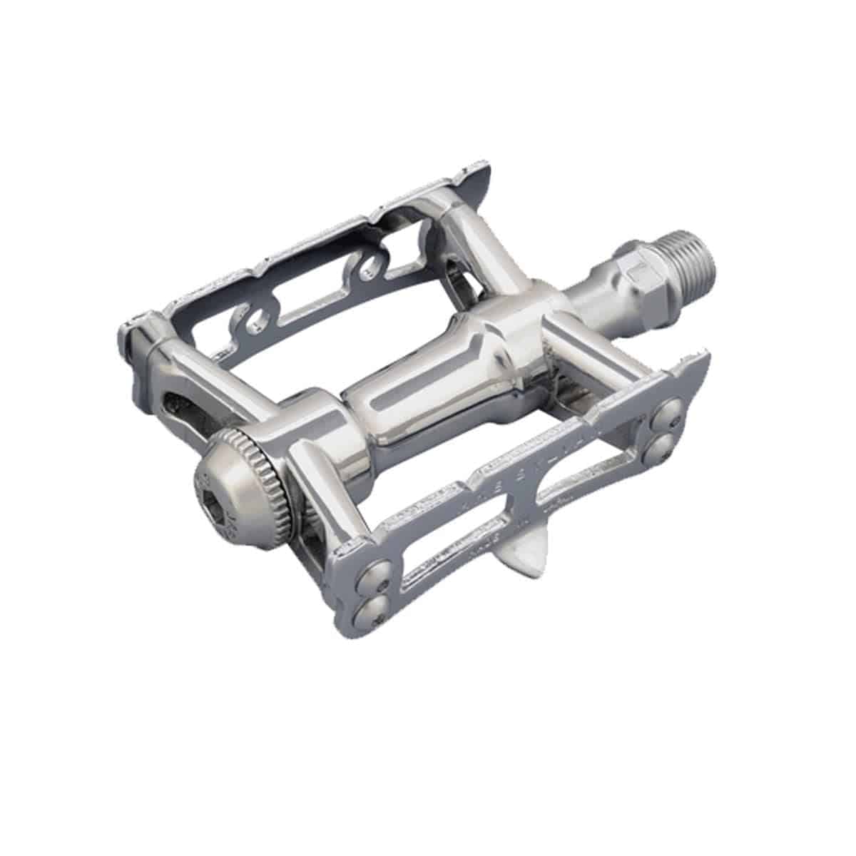 MKS Sylvan Track Next silver cycling pedal with one-sided design for track and road biking, mounted on a bike crank.