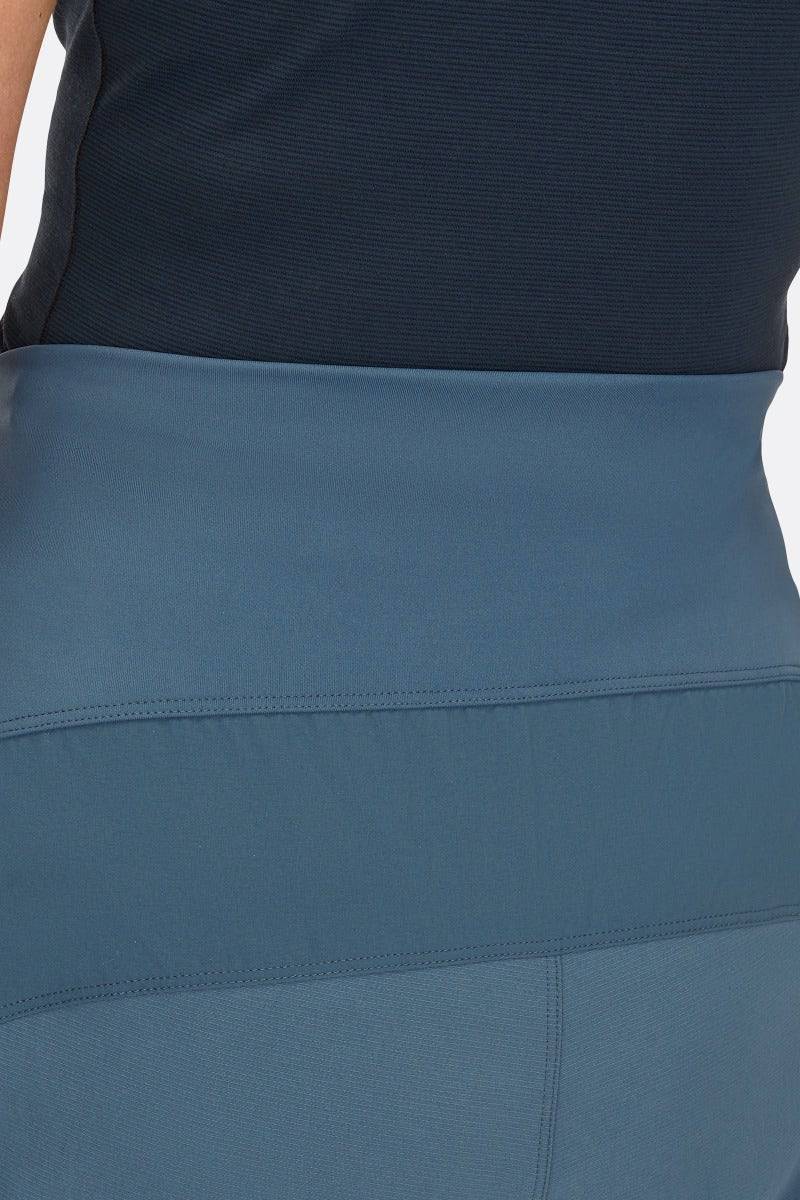 Rab Cinder Crank Women's cycling softshell pants in Orion Blue, showing durable, breathable fabric and detailed fit.