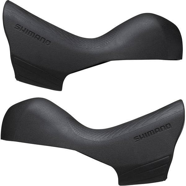 Pair of Shimano 105 ST-R7020 shifter bracket covers, genuine replacement bicycle components for smooth gear shifting.