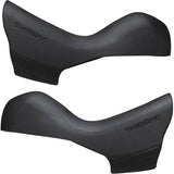 Pair of Shimano 105 ST-R7020 shifter bracket covers, genuine replacement bicycle components for smooth gear shifting.
