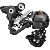 Shimano Saint RD-M820 10-speed rear derailleur with Shadow+ design and MTB direct mount, showcasing durable metal construction.