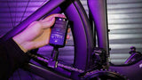 Finish Line Halo Wet Lubricant with Smart Luber for bicycle chains, shown in workshop setting, designed for optimal bike chain performance.