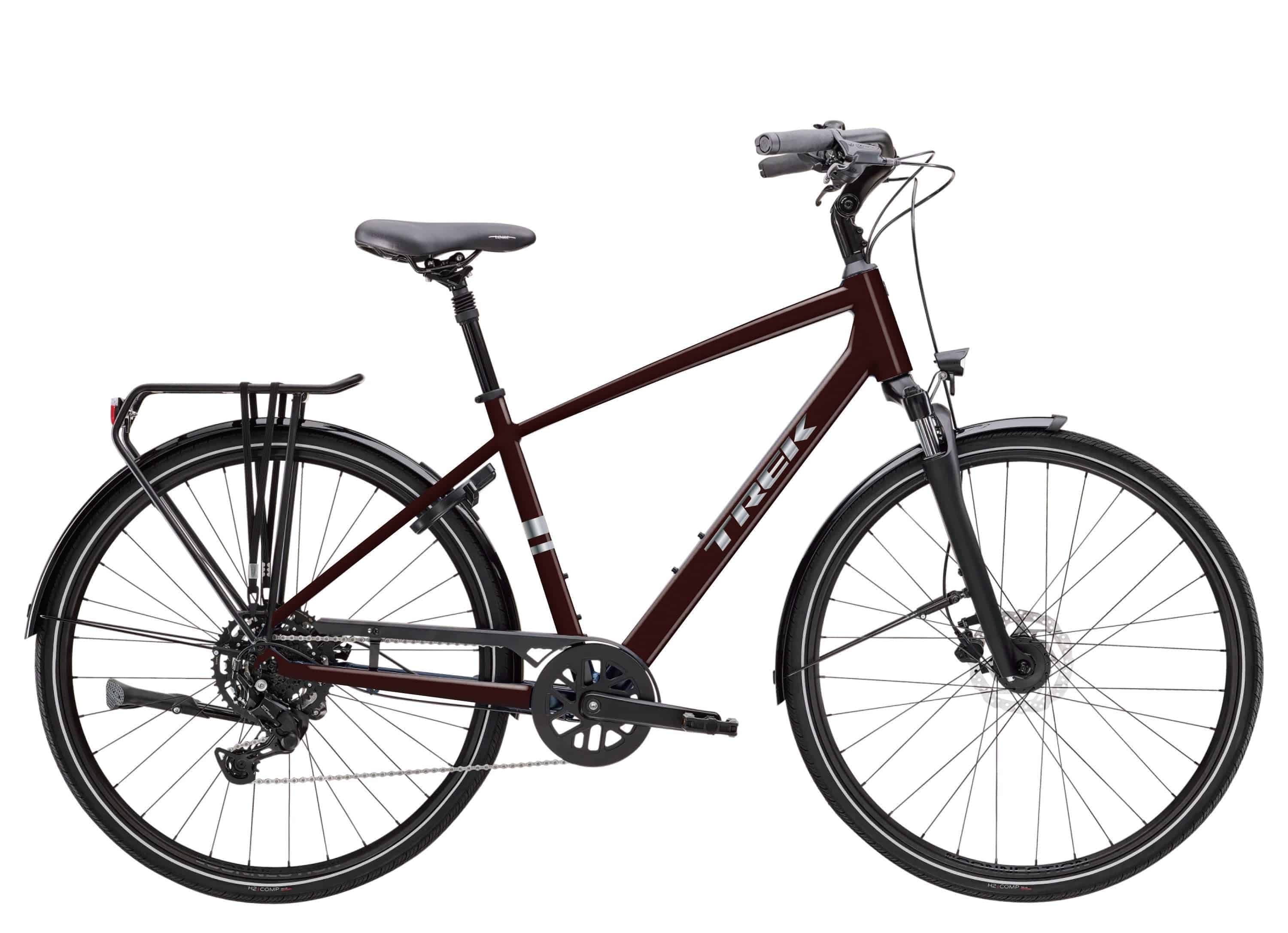 Trek Verve hybrid bike with Shimano CUES drivetrain and LINKGLIDE technology, showcasing the bike's frame and gear system.