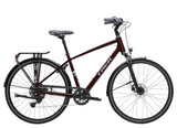 Trek Verve hybrid bike with Shimano CUES drivetrain and LINKGLIDE technology, showcasing the bike's frame and gear system.