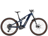 Trek Powerfly FS+ 8 2025 electric mountain bike with Gen 4 motor and SRAM GX AXS drivetrain, black and red frame, outdoor trail setting
