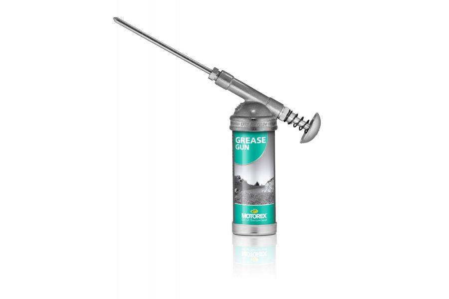Motorex Silver/Green bike grease gun for workshop use, designed for efficient lubrication of bicycle components.