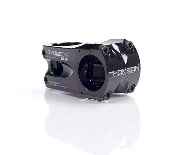 Thomson Elite X4 MTB stem in black, 1.5 x 4 inches, 0° angle, mounted on 31.8mm handlebars, close-up view.