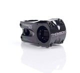 Thomson Elite X4 MTB stem in black, 1.5 x 4 inches, 0° angle, mounted on 31.8mm handlebars, close-up view.