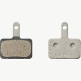 Shimano M05-RX resin disc brake pads with steel back plate for 2 piston bike brake systems, showing the brake pad surface and backing plate.