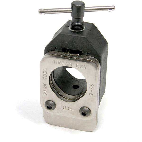 Park Tool SG-6 threadless fork saw guide for precise steerer tube cutting, shown in a workshop setting.