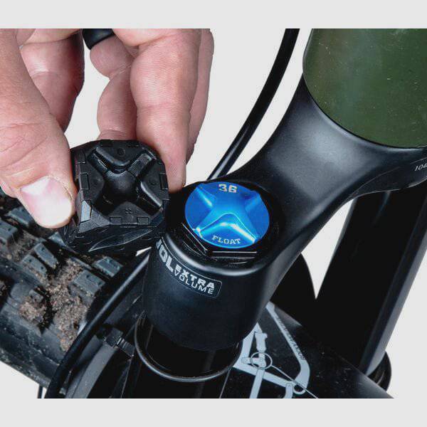Park Tool FCT-1 fork cap tool for suspension forks, compatible with FOX, RockShox, DVO, Marzocchi, and Öhlins in a workshop setting.