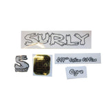 Surly M5 bike frame plugs with headbadge, metal components for bicycle frame protection and customization.