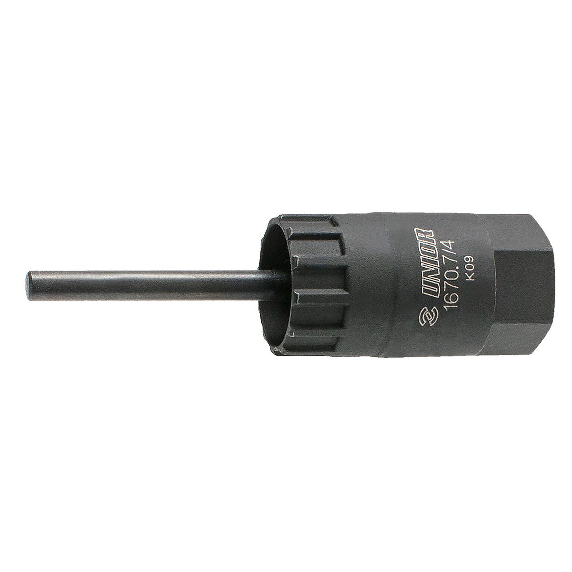 UNIOR cassette lockring tool with guide for precise installation and removal, used in bike workshop maintenance.