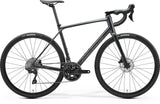 Merida Scultura Endurance 400 road bike with Shimano 105 hydraulic disc brakes, featuring a lightweight frame and drop handlebars.