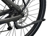 Giant Explore E+ 4 Stagger e-hybrid bike with Long-Range EnergyPak 800 battery and Aegis safety features, parked outdoors.
