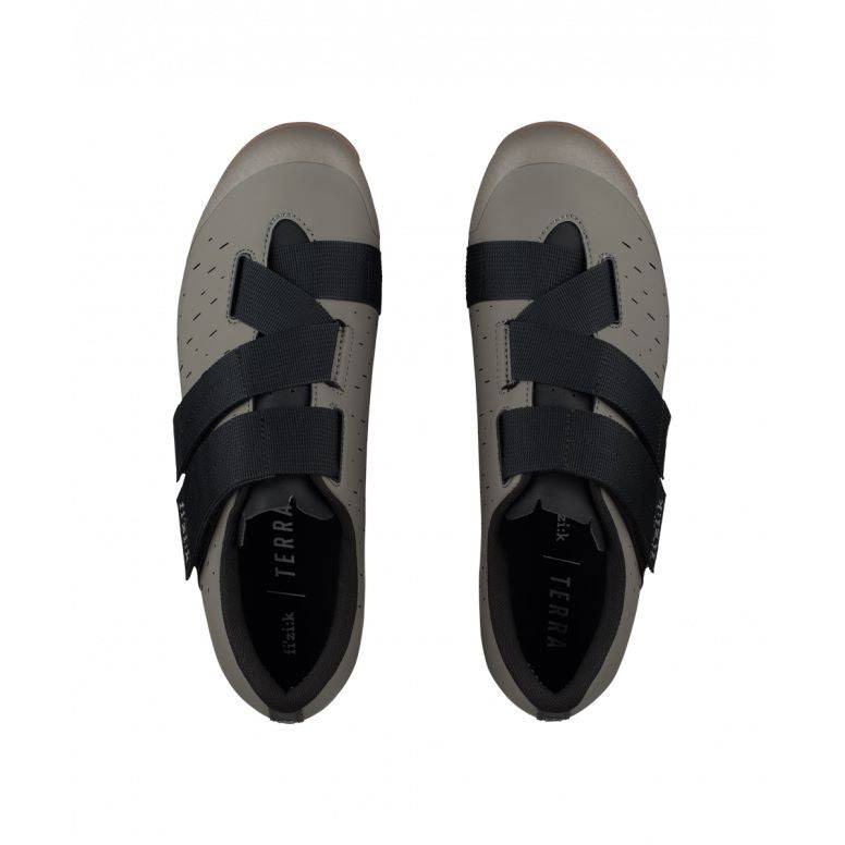 Fizik X4 Terra gravel cycling shoes with adjustable fit and durable outsole, designed for gravel riding and cycling comfort.