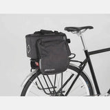 AtranVelo ZAP Top AVS bike bag with expandable design and mini-panniers, shown attached to a bicycle rack.