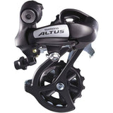 Shimano Altus RD-M310 SGS black rear derailleur for 7-8 speed mountain bikes, showing the component's design and branding.