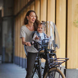Urban Iki front child seat TA-KE for bikes, weather-resistant bike seat designed for safety and comfort for young children.