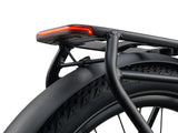 Giant Explore E+ 2 Stagger MY26 electric hybrid bike with SyncDrive Sport2 motor and safety features, shown outdoors.
