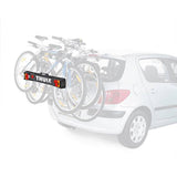 Thule 976 light board accessory with rear lights and number plate visibility for bike racks, mounted on a vehicle.