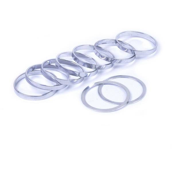 Wheels Manufacturing single speed conversion kit spacers for Shimano freehub bodies, showing metal spacers and components.