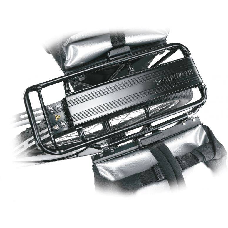 Topeak Super Tourist DX black rear bike rack mounted on touring bike with panniers, designed for 26-inch and 700C wheels.