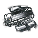 Topeak Super Tourist DX black rear bike rack mounted on touring bike with panniers, designed for 26-inch and 700C wheels.