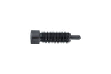 Black Topeak 11-speed bike chain pin link for repair, shown in workshop setting with tools and bike components.