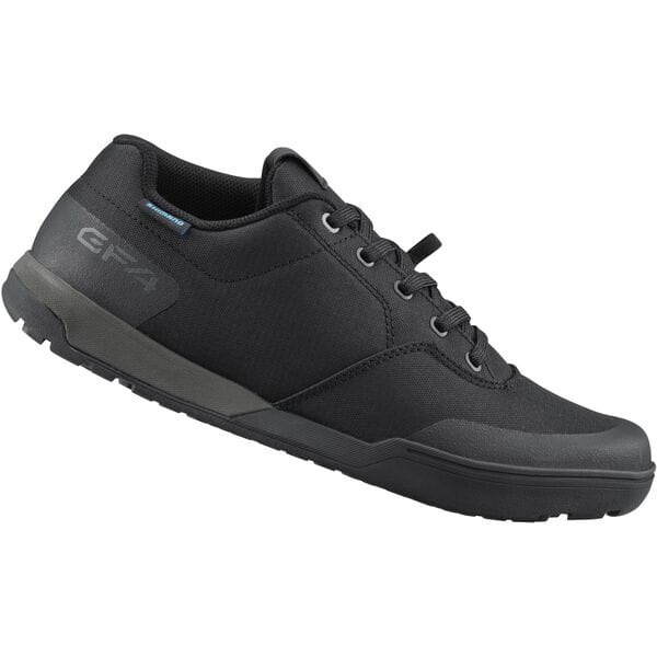 Shimano GF4 gravel shoes with ULTREAD® grip for flat pedals, designed for cycling, shown in a close-up view of the footwear.