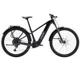 Trek Powerfly+ 4 equipped Gen 5 e-mountain bike with 800Wh removable battery, showing the bike's frame and motor in detail.
