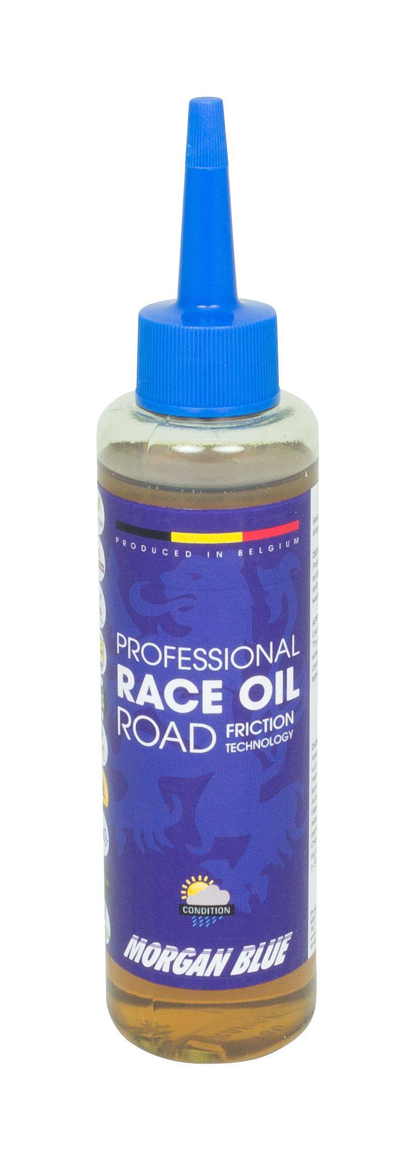Morgan Blue Race Oil road bike lubricant in a workshop setting, showcasing the friction-reducing bike oil for optimal performance.