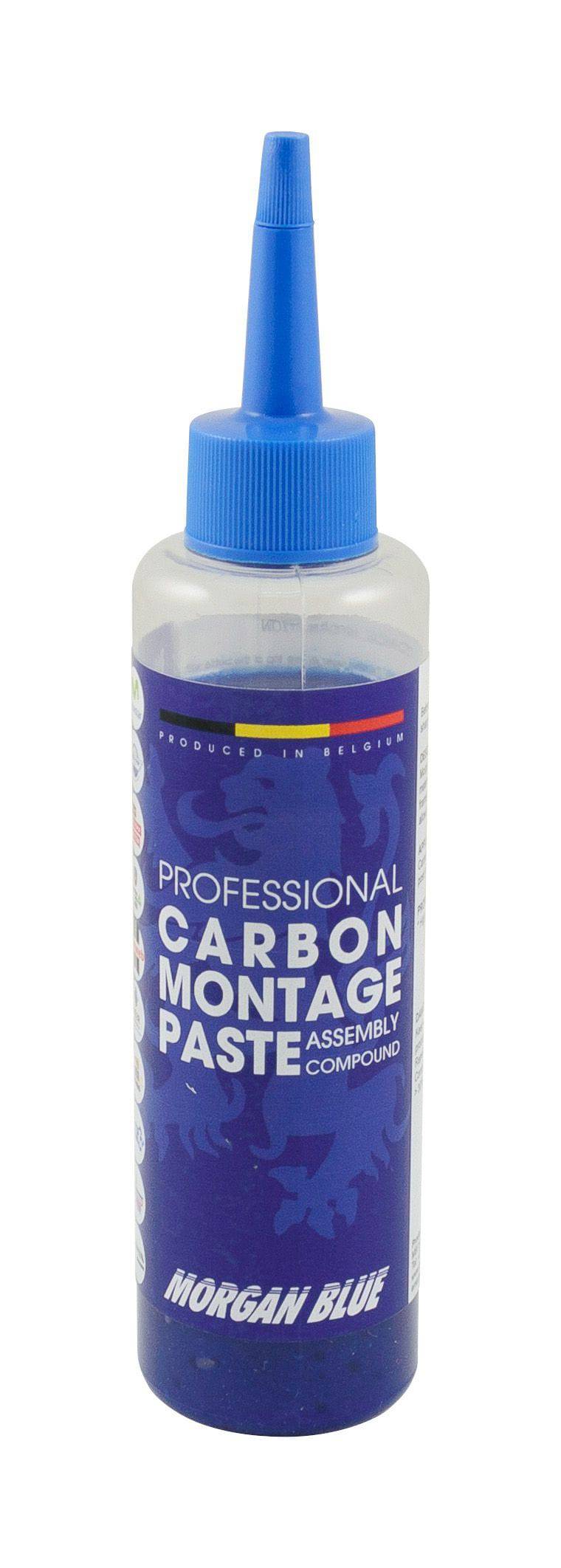 Morgan Blue Carbon Assembly Paste tub for lubricating carbon and aluminium bike parts, shown in a workshop setting.
