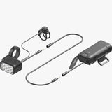 Knog Blinder X 1800 front bike light with 10,000mAh battery pack and remote, mounted on a bicycle handlebar.