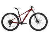 Liv Tempt 2 mountain bike 2024 with Shimano CUES U4000 drivetrain and disc brakes, shown outdoors on a trail.