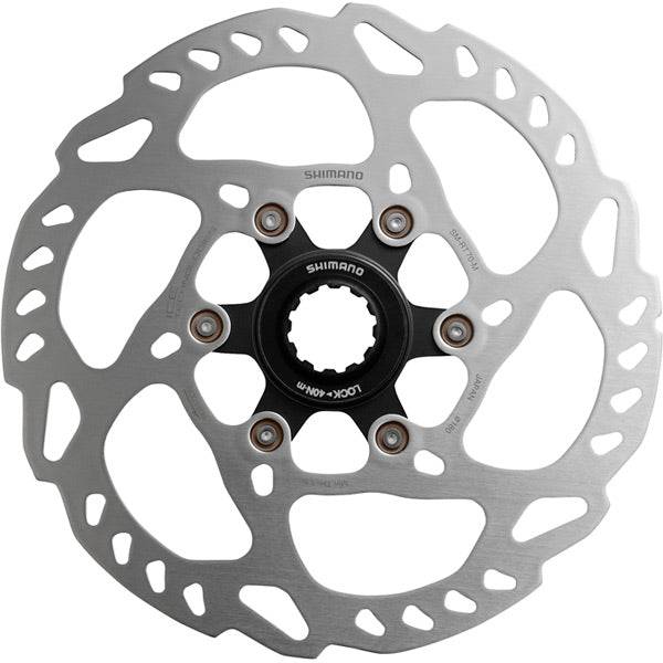 Shimano SM-RT70 Center Lock Rotor with Ice Tech for bike braking, showing the silver disc with center lock mount and ventilation features.