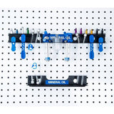 Park Tool JH-4 wall-mounted bleed kit organizer for hydraulic brake accessories, stored on a workshop wall.