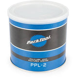 Park Tool PPL-2 Polylube 1000 bicycle grease for carbon and all components, shown in a workshop setting with grease tube visible.