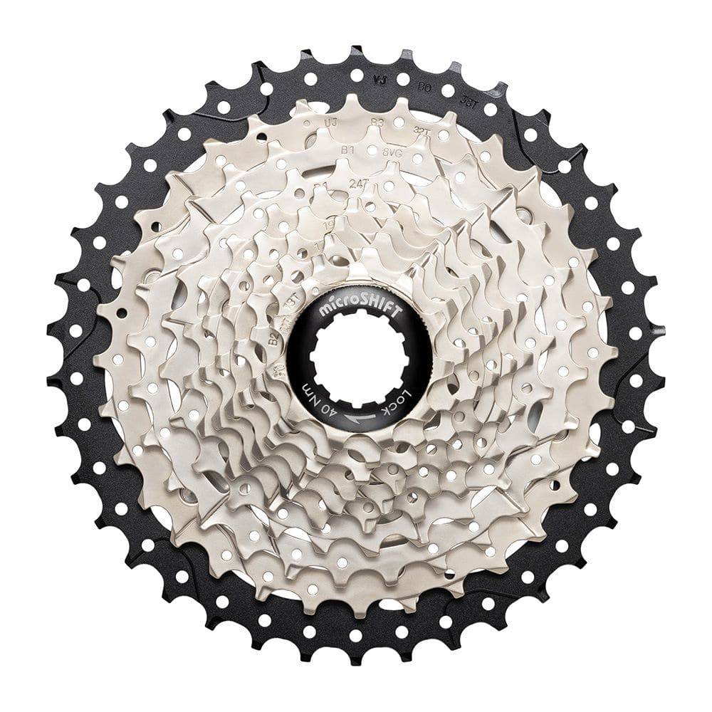MicroSHIFT Sword G-Series 10-speed cassette with 11-38T gear ratio for standard freehub wheels, shown on a bike wheel.