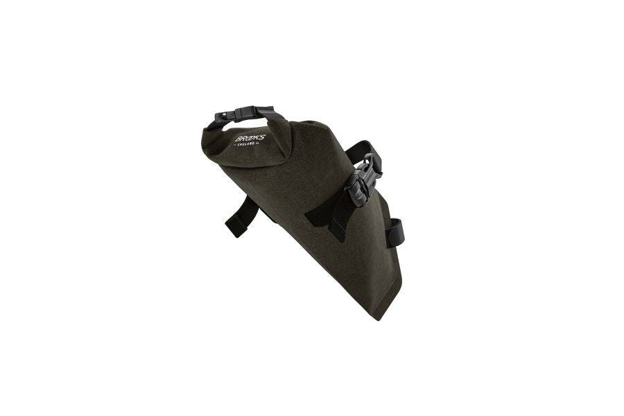 Brooks Scape Saddle Roll Bag in mud green, waterproof bikepacking accessory with 1.5L capacity attached to bike saddle