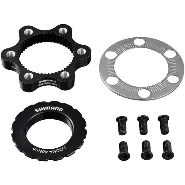 Shimano SM-RTAD05 6-bolt rotor to center-lock hub disc brake adapter installed on a mountain bike wheel.