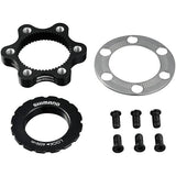 Shimano SM-RTAD05 6-bolt rotor to center-lock hub disc brake adapter installed on a mountain bike wheel.
