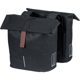 Black Basil City Double Bicycle Bag with water-repellent fabric, reflective panels, designed for 28-32L bike pannier accessories.