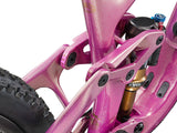 Liv Intrigue X Advanced 0 mountain bike with adjustable geometry and suspension system, shown in a riding outdoor setting.