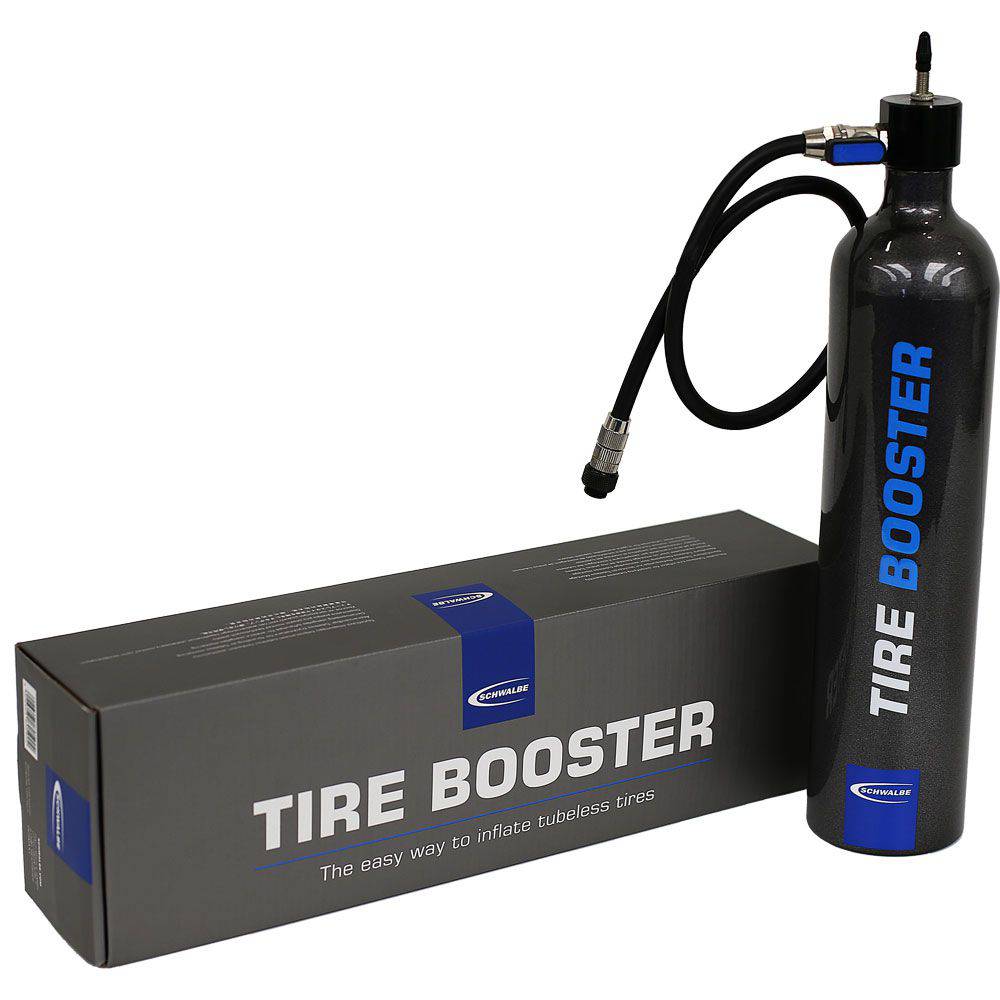 Schwalbe Tyre Booster Hand Pump for rapid tubeless tyre inflation and assembly, showing the pump and accessories in use.