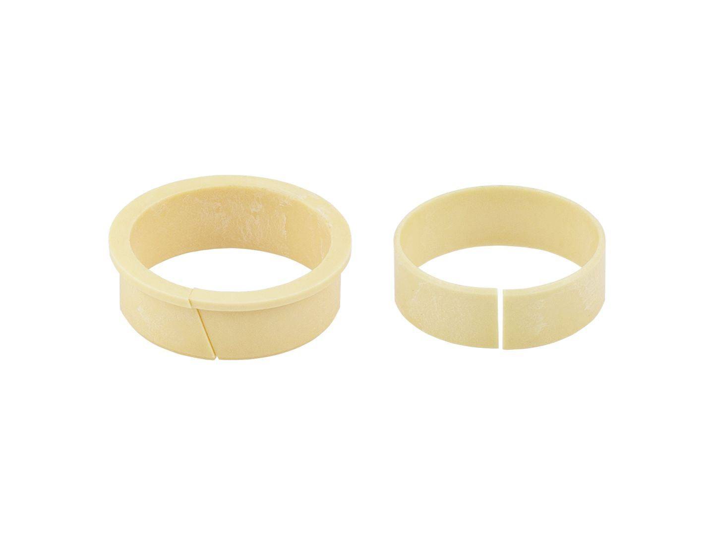 Bontrager Line Elite 34.9mm dropper post bushing kit in cream, showing close-up of bushings and components for bike suspension.