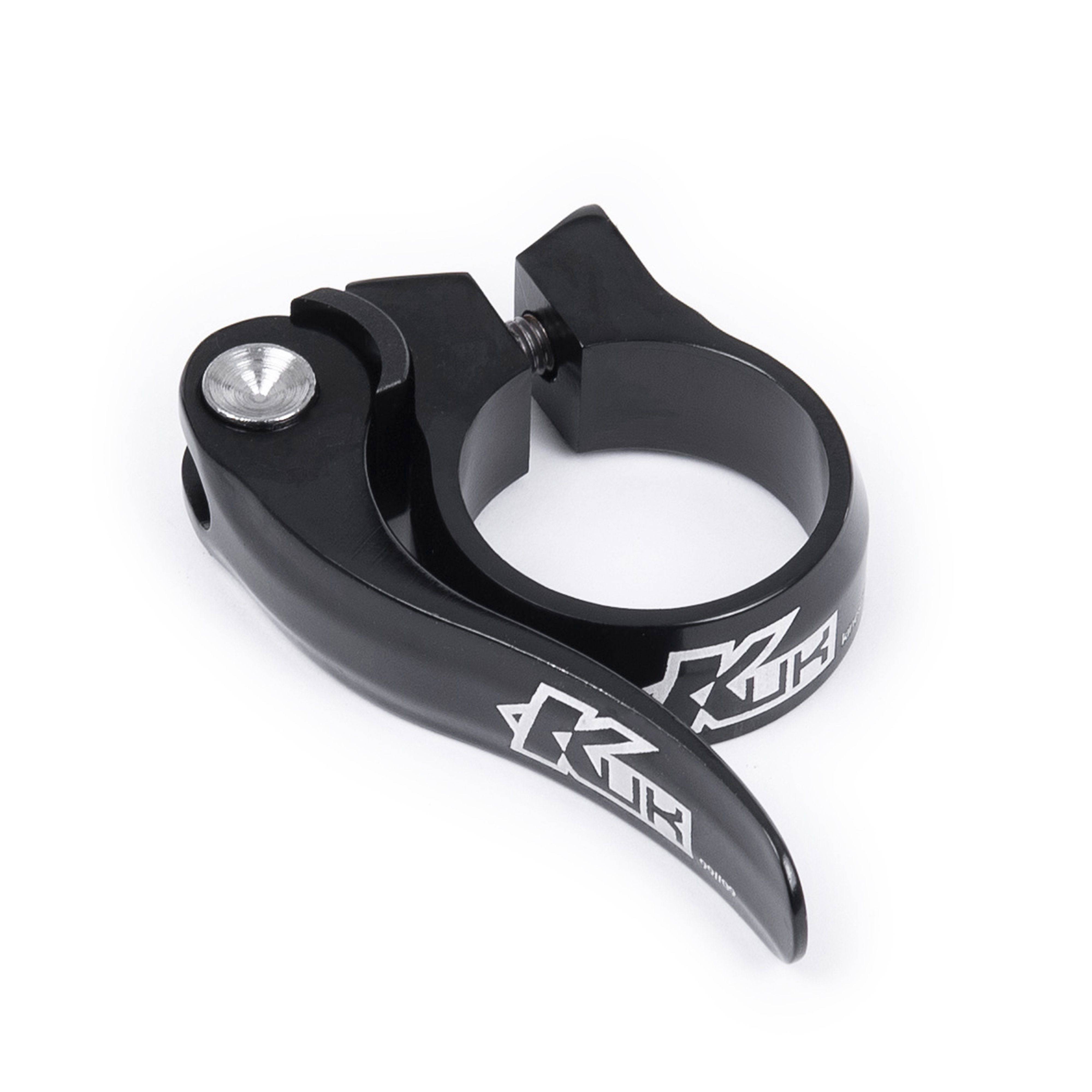 Black KUK quick release seat clamp for 28.6mm Kinesis seat posts, made by Upgrade, shown on a bicycle component.